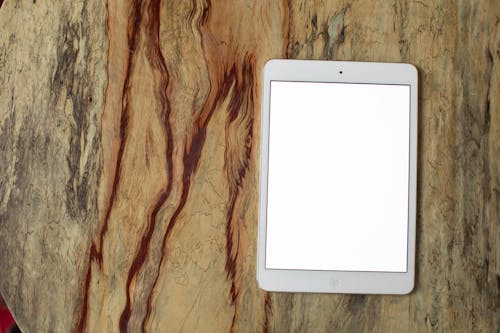 Free An Ipad on Wooden Surface Stock Photo