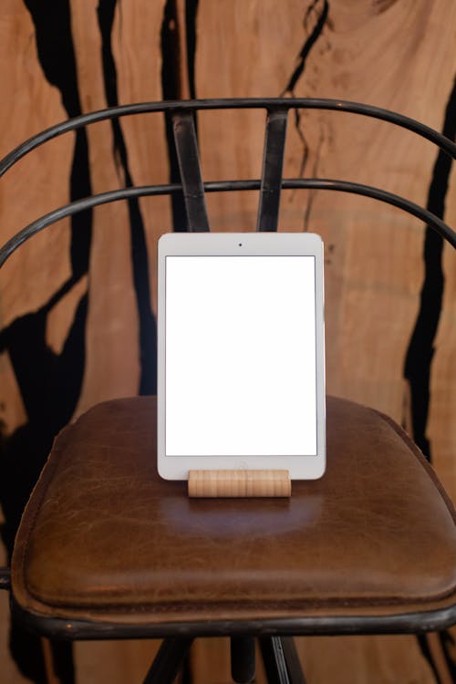 Tablet Displaying a Blank White Screen Standing in a Tablet Stand 