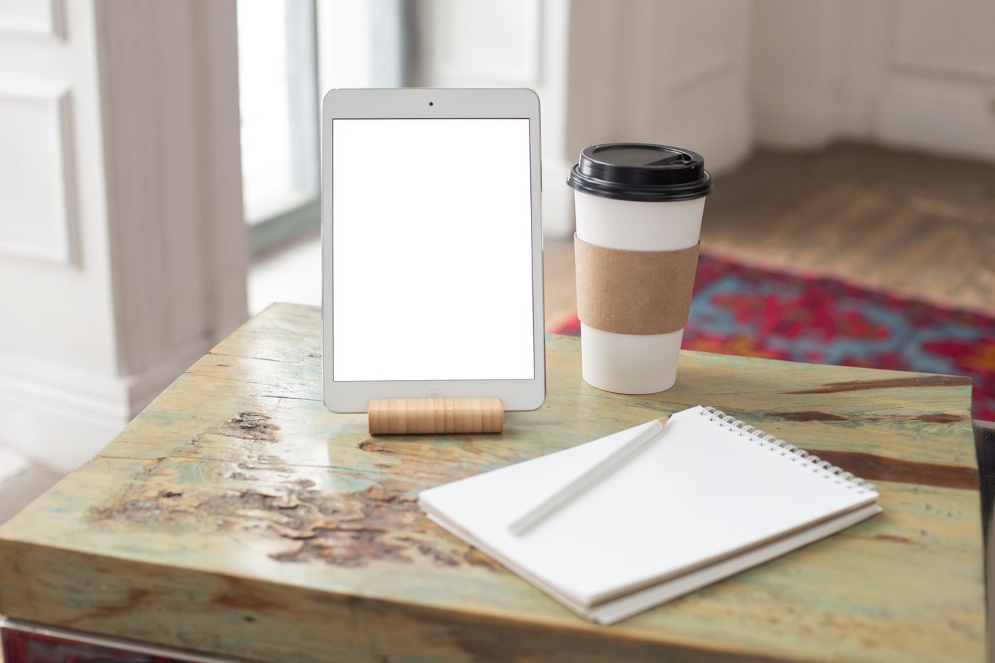 Landscape tablet and notebook workspace for planning a Canva lead magnet template