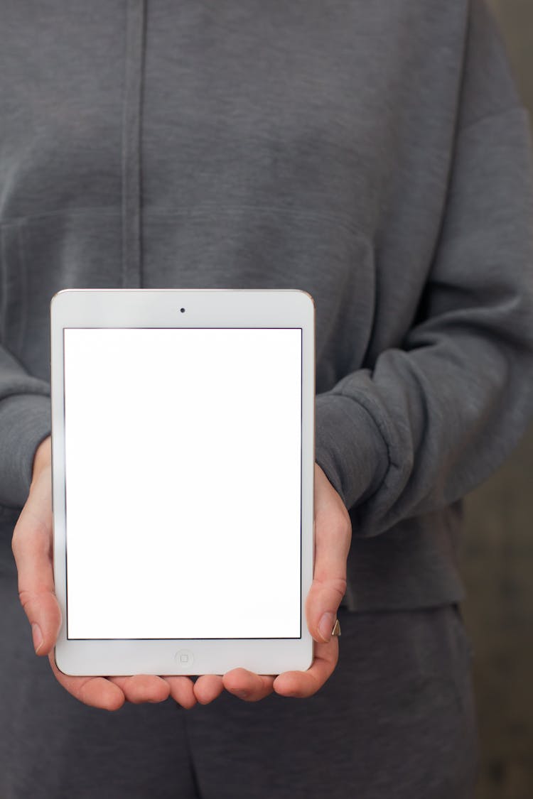 A Person Holding An Ipad