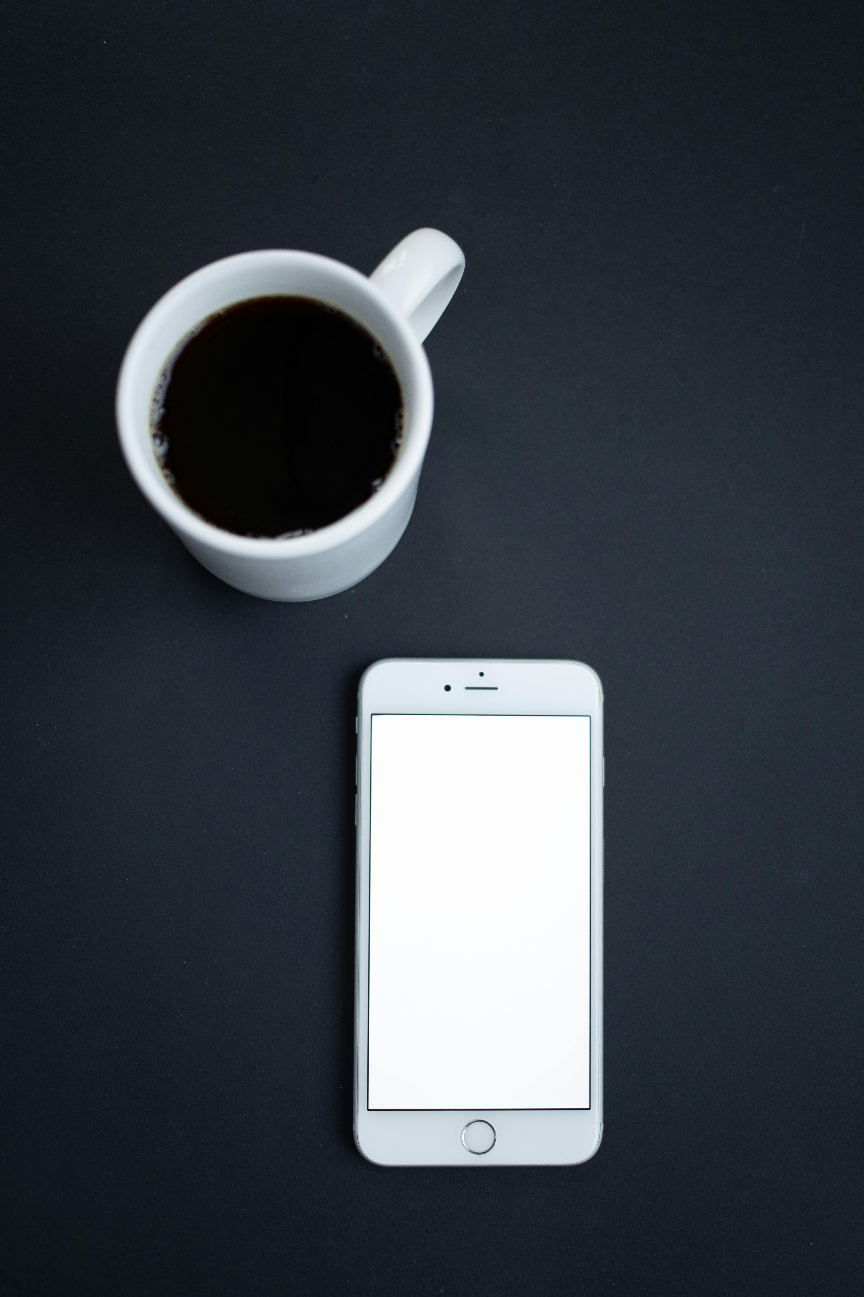 close up of smart phone and coffee