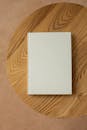 Book with white hard cover on table