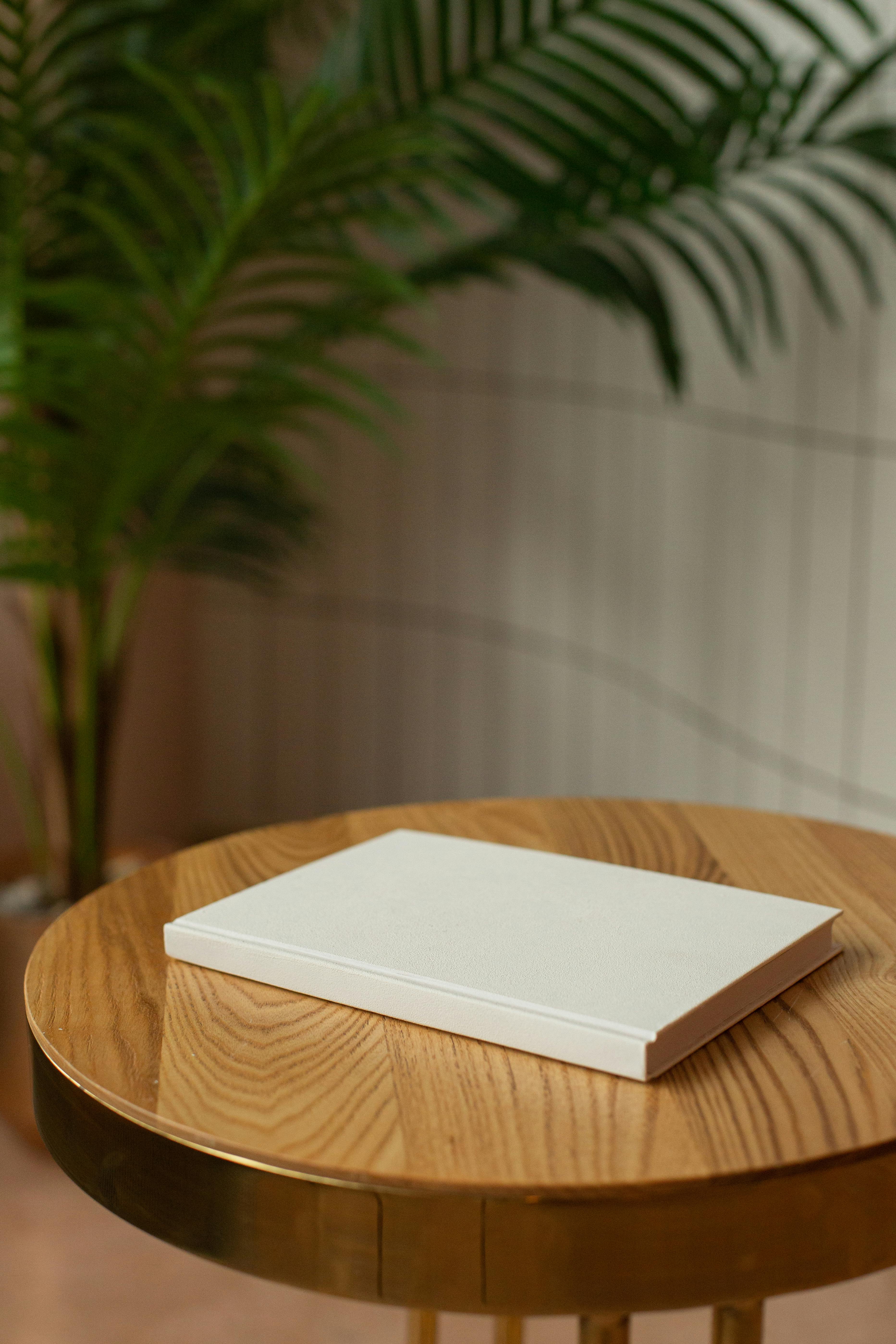 wooden table with empty hardcovered book