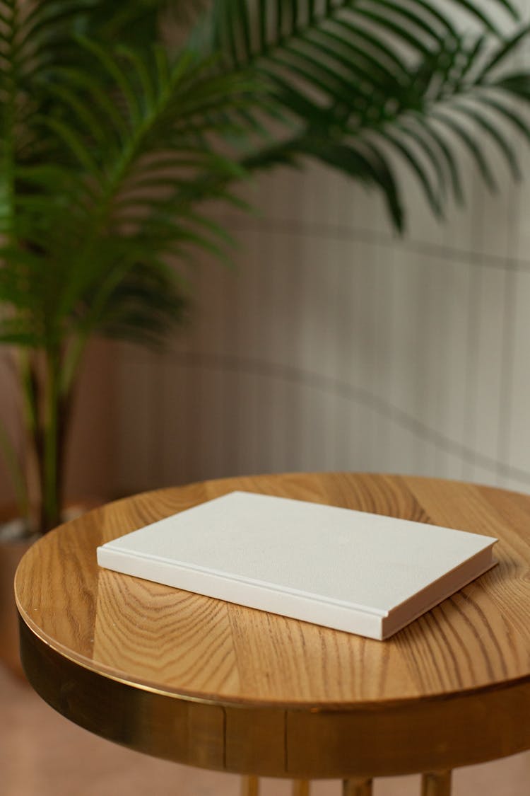 Wooden Table With Empty Hardcovered Book