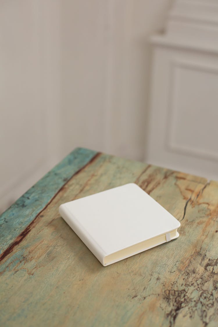 Book With Empty White Cover On Table