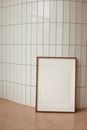 Blank white frame near wall