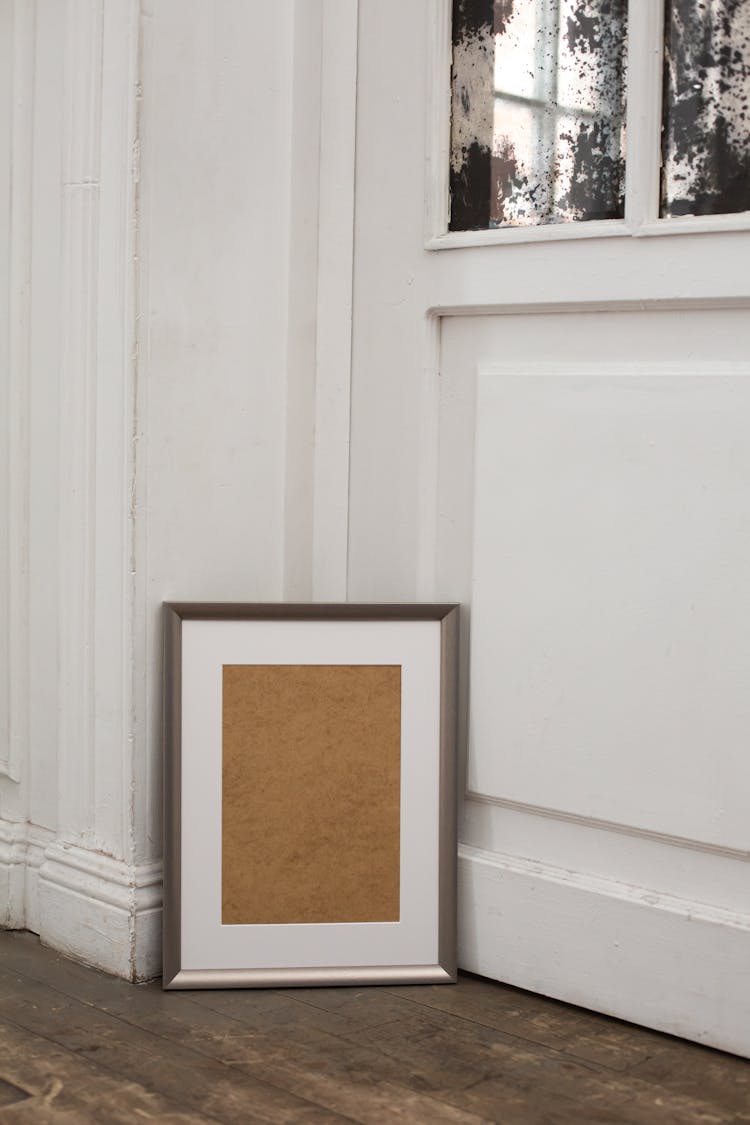 Classic Interior Of Apartment With Empty Frame On Floor