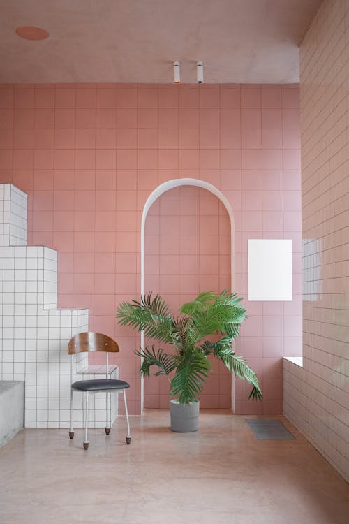 Interior of spacious stylish room with pink walls