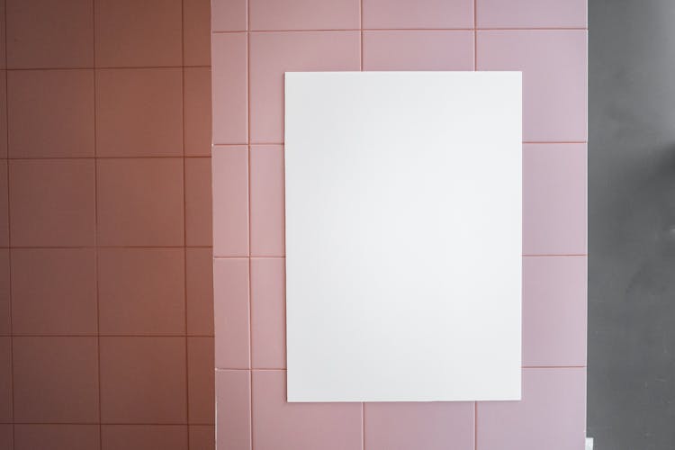 White Poster Placed On Tile Wall