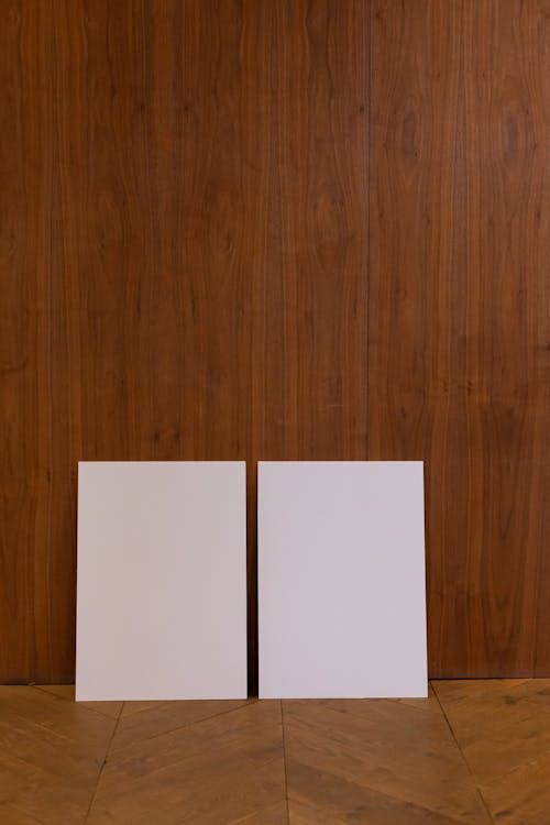 Free Empty canvases placed on wooden floor Stock Photo
