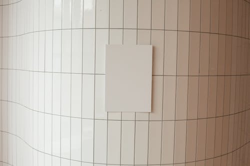 White canvas on tile wall in room