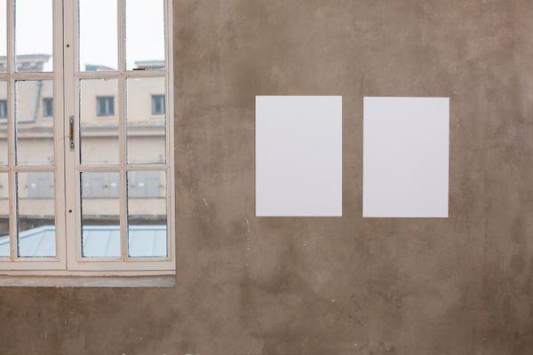 Blank canvases on a bare wall in an empty daylit room — Monstera Production on Pexels