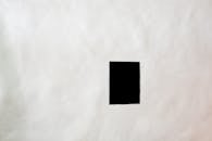 Black blank sheet on wall