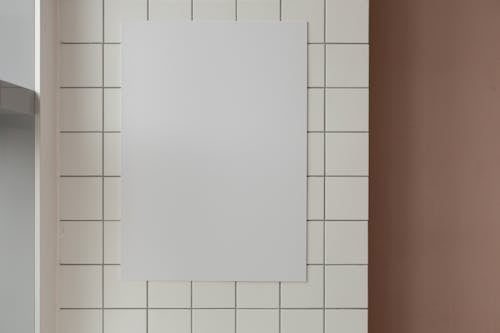 Free Empty paper on tiled wall Stock Photo