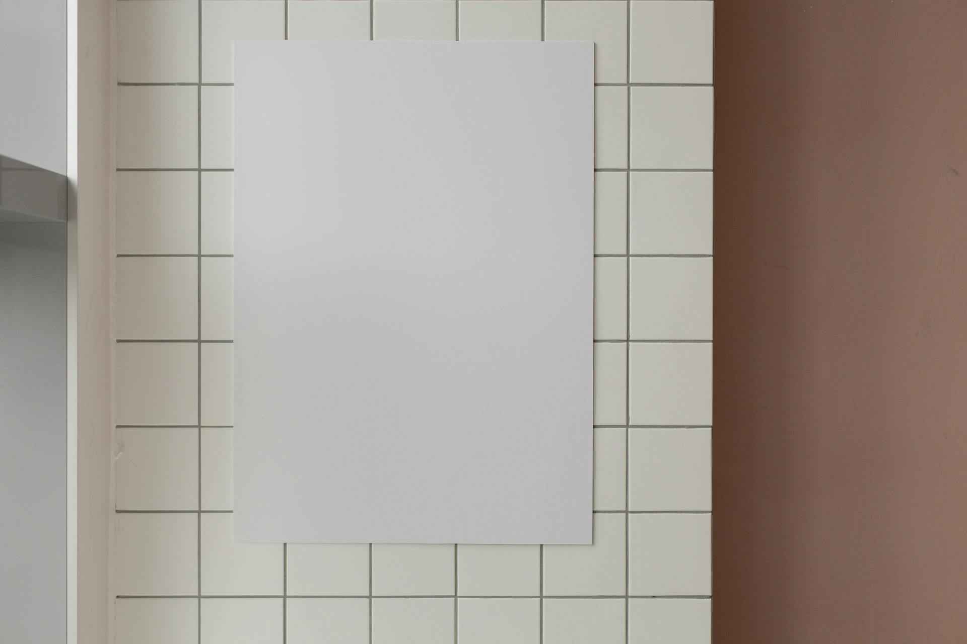 Empty paper on tiled wall