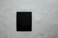 Black blank paper on wall