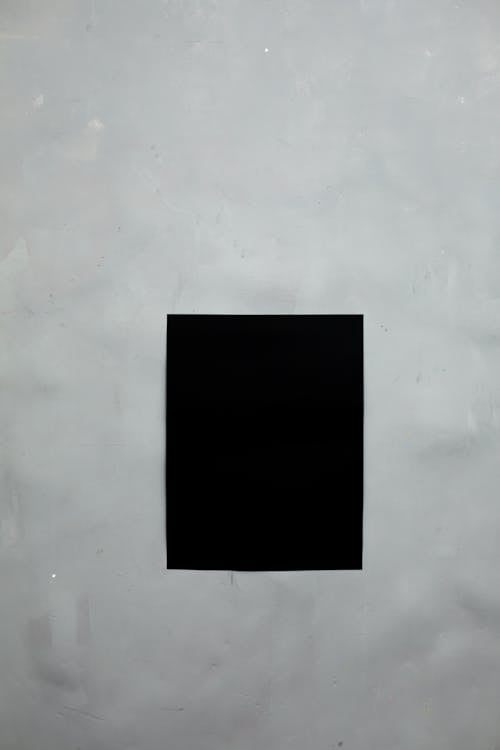Black empty poster on wall