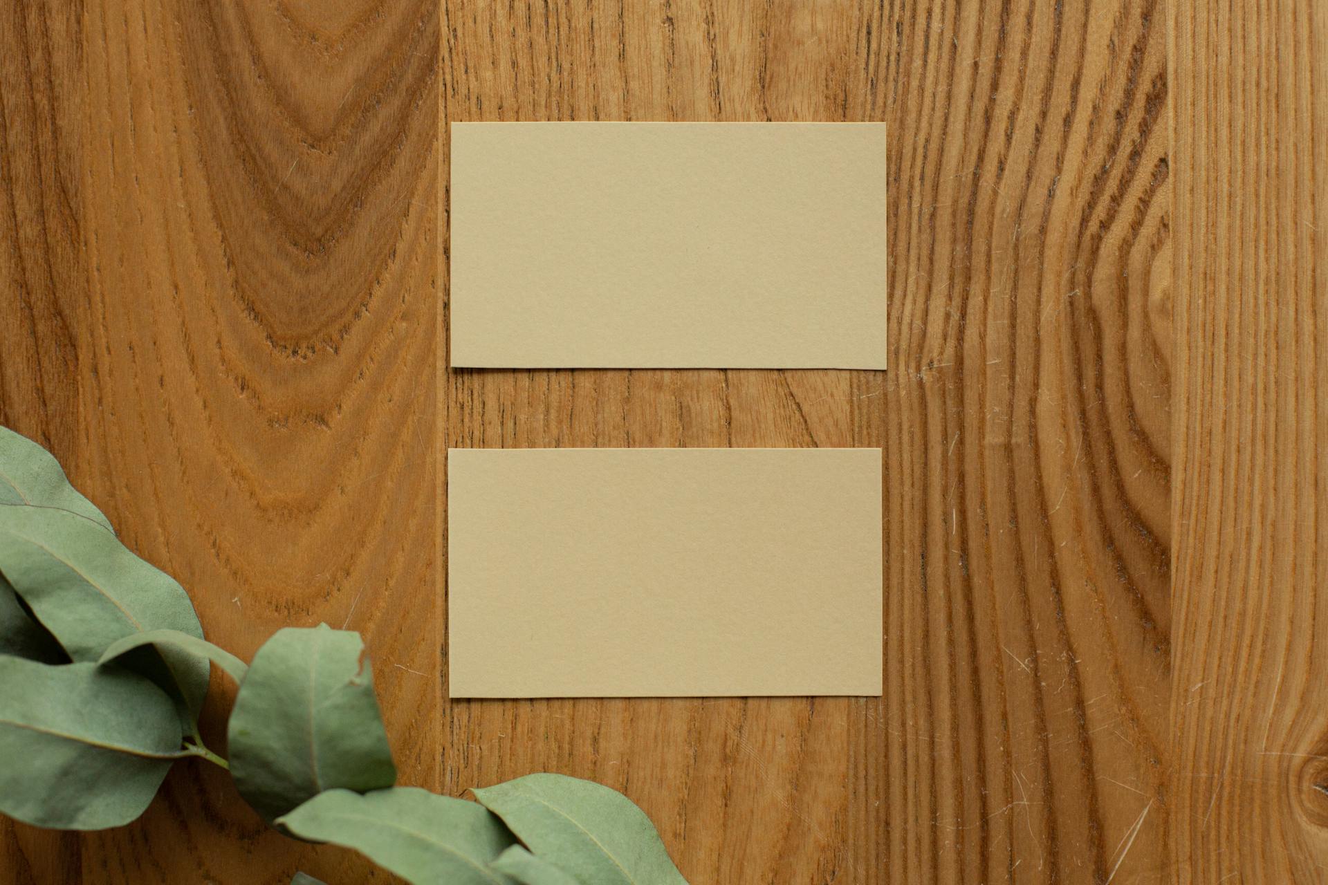 Blank business cards on wooden table