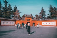 People Standing near a Concrete Building