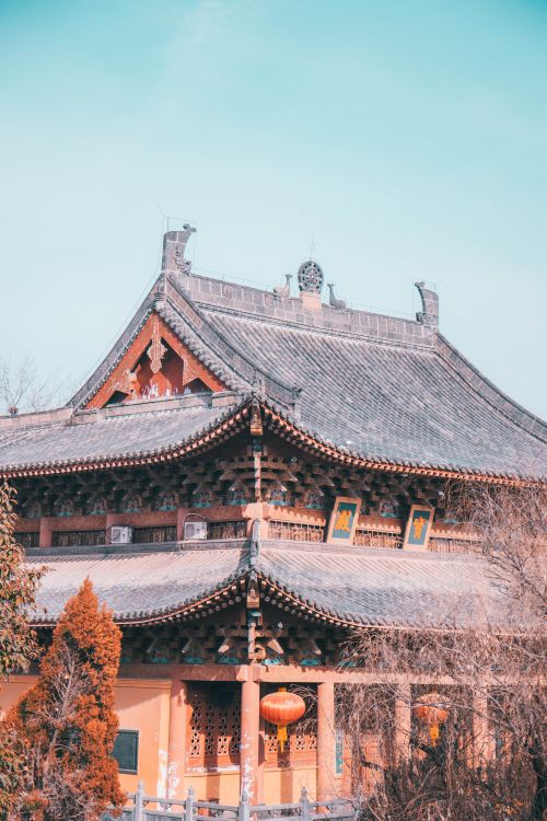 Free A beautiful example of traditional Asian architecture captured in a vibrant, daylight setting. Stock Photo