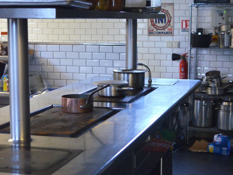 Commercial kitchen with hood and stainless steel line