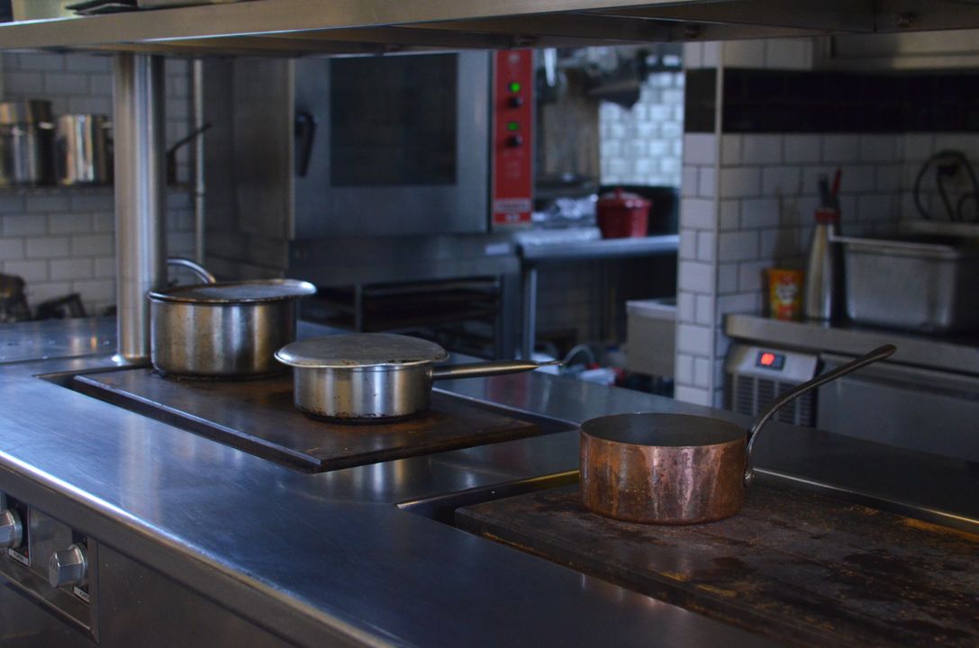 Banquet Chef Career Path: The Large-Scale Cooking Skills Hotels Look For 3 Large stainless steel pots on a counter in a professional kitchen