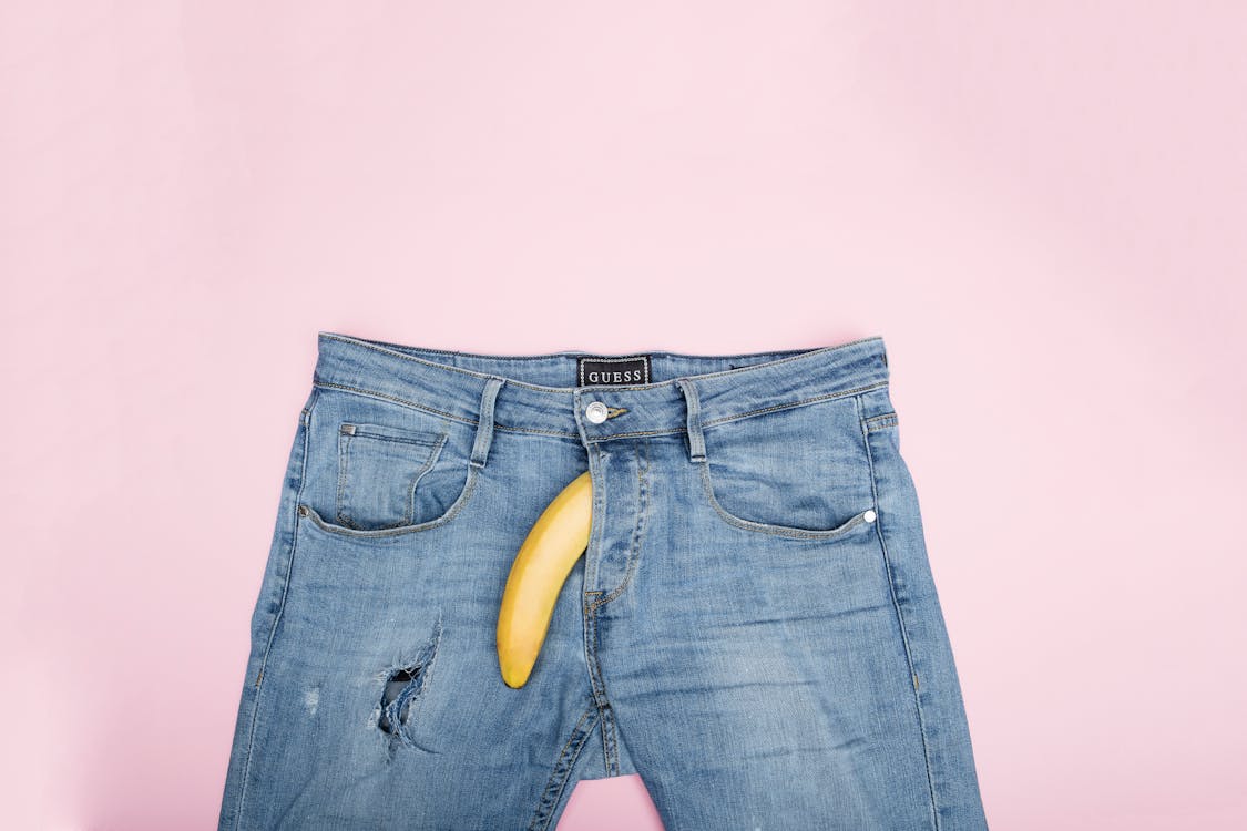 Free Blue Denim Jeans on the Table Stock Photo
