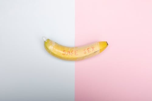 Free Yellow Banana on Pink Surface Stock Photo