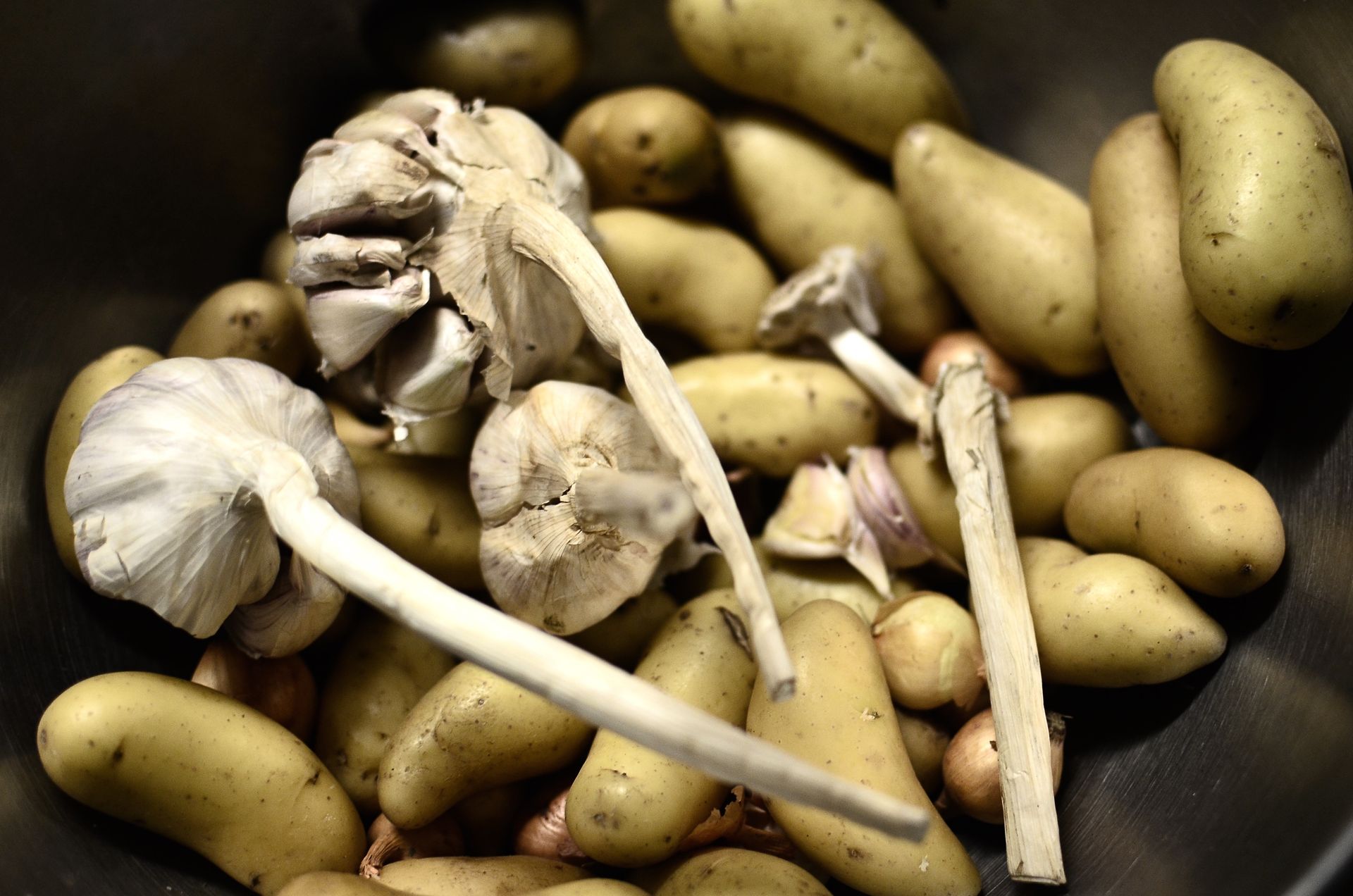 Close-Up Shot of Potatoes and Garlic