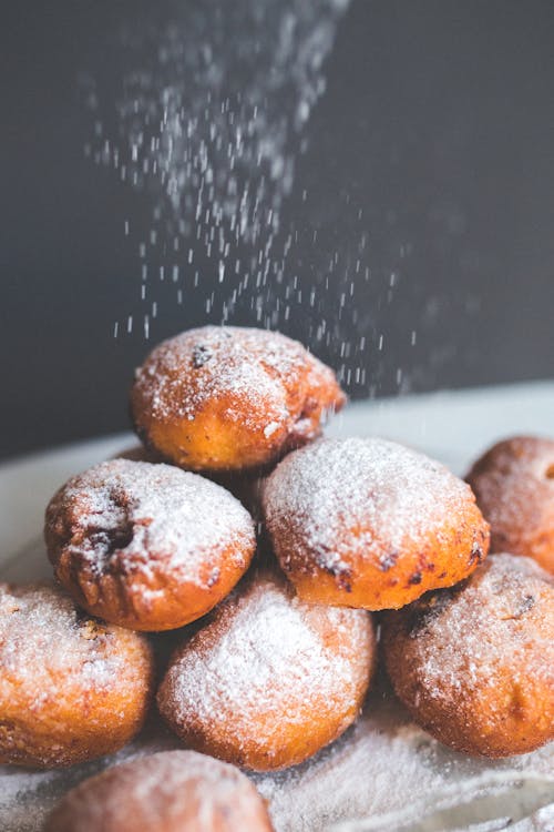 Falling powder sugar on donuts