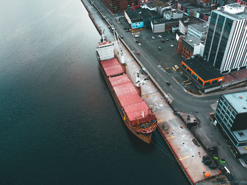 customs officer reviewing freight import documentation at port desk