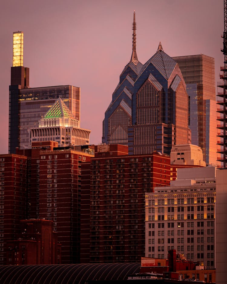 The One Liberty Place Beside City Buildings In Philadelphia, Pennsylvania, USA