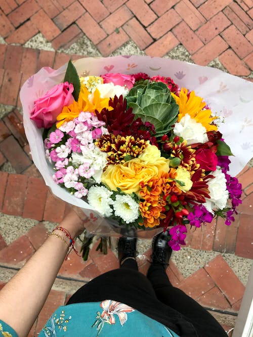 Person Holding Colorful Flower Bouquet