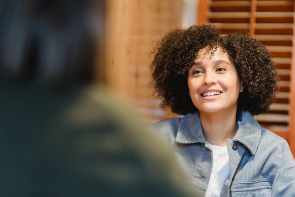 Group of latina women smiling together — finding a bilingual therapist article