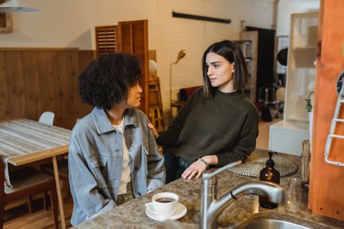 Crying black woman sharing problems with friend · Free Stock Photo