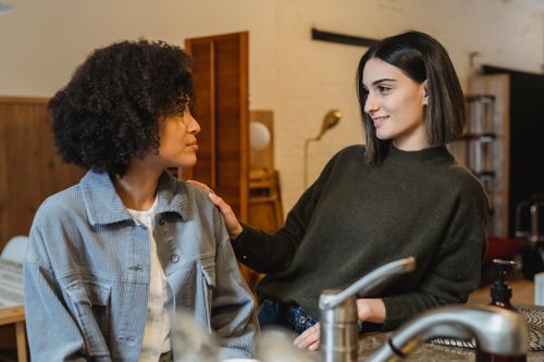 Crying black woman sharing problems with friend · Free Stock Photo