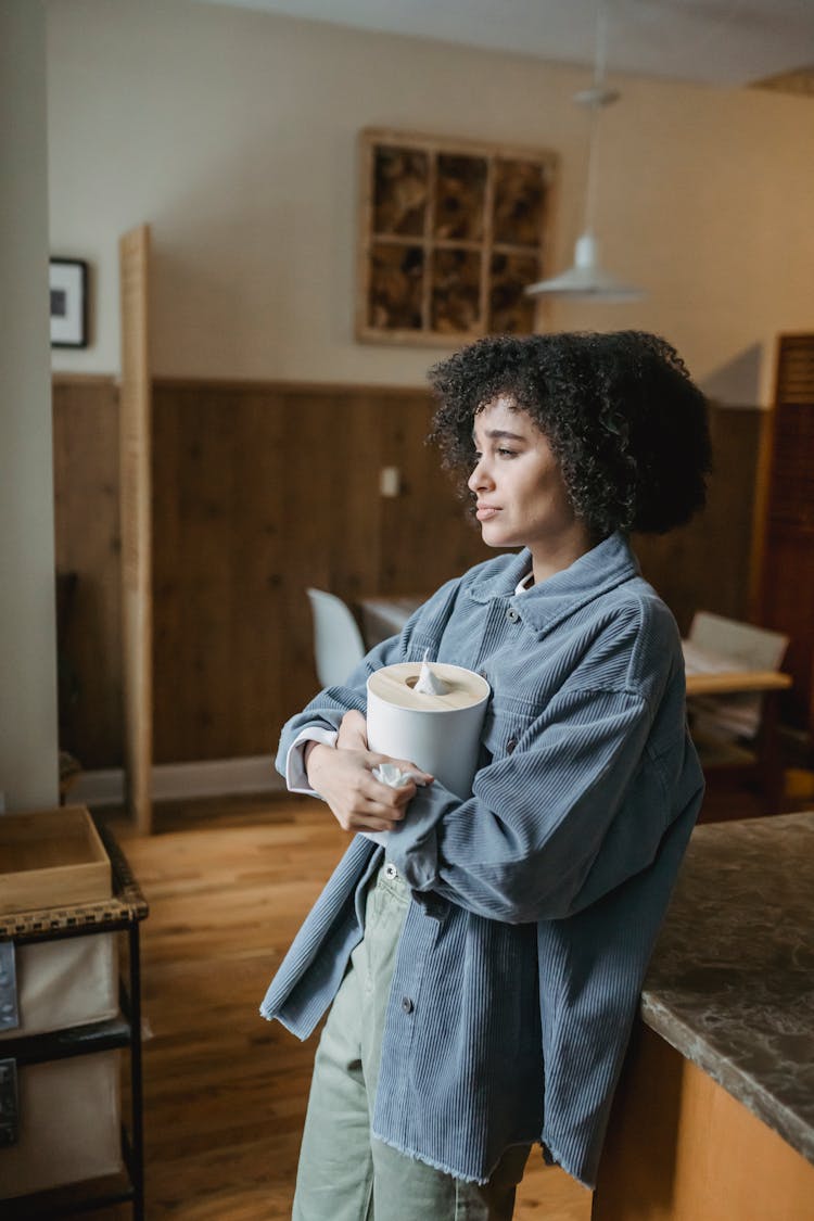 Sorrowing Black Woman Crying With Box Of Tissues