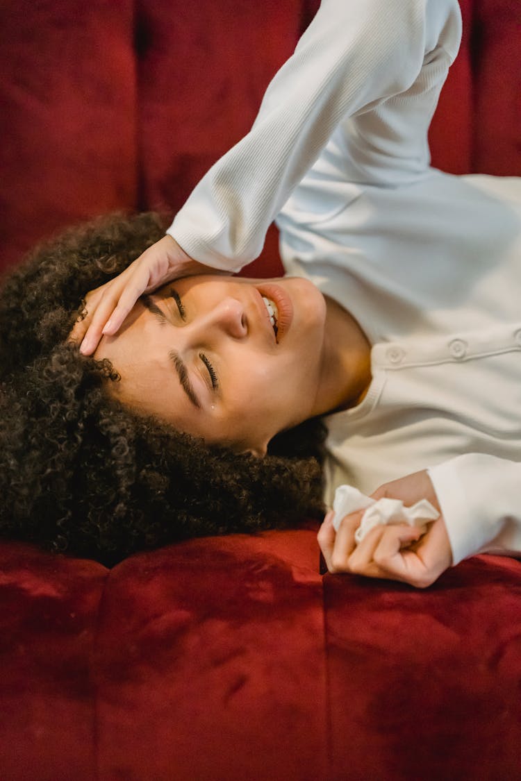 Sad Black Woman Lying On Couch