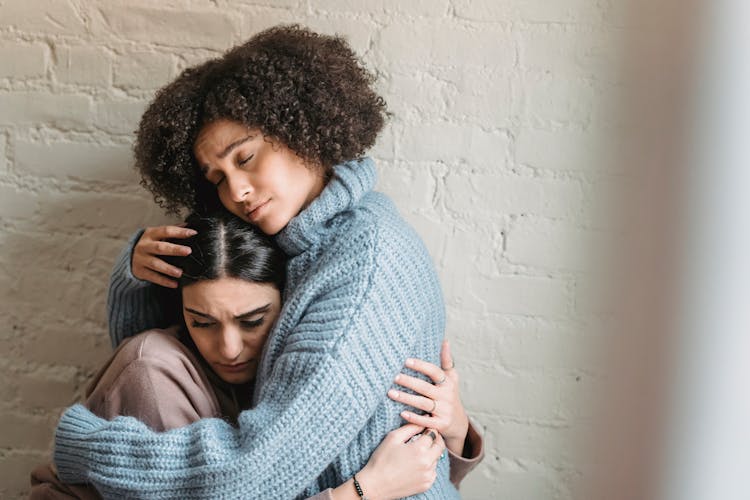 Black Woman Comforting Upset Friend