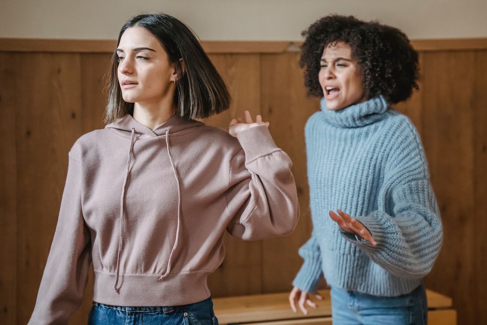 Tense friends reacting to a sudden bankroll loss during a colorful virtual casino round