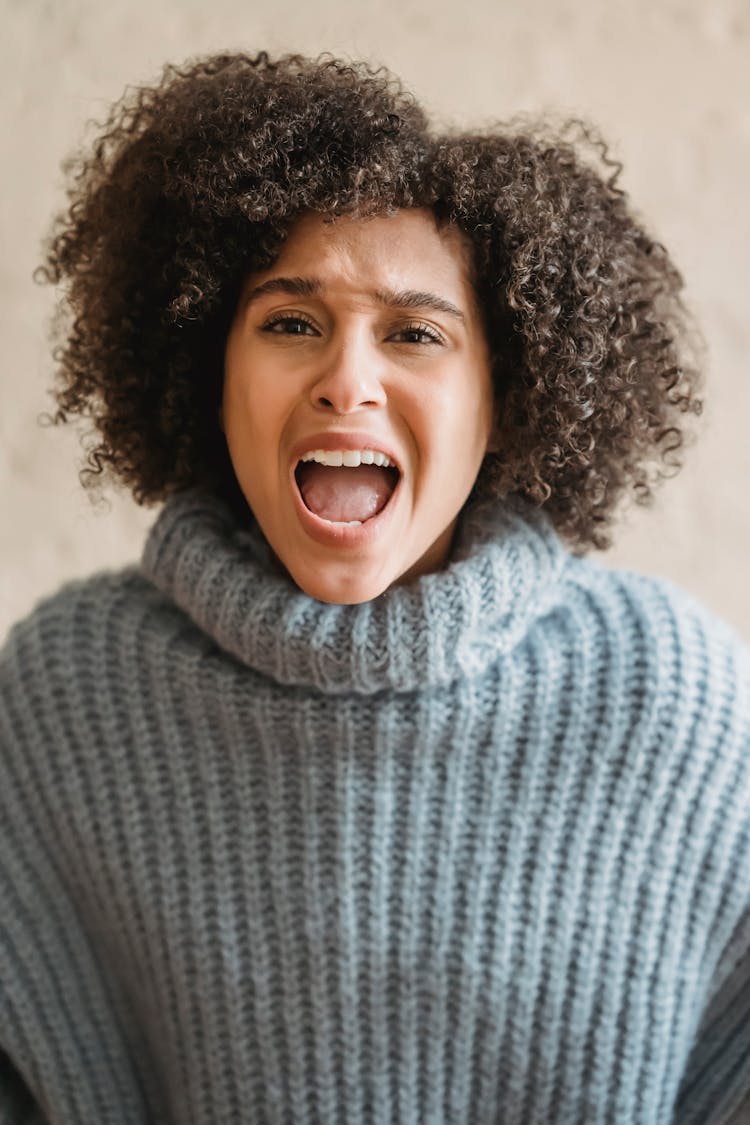 Expressive Black Woman Yelling And Looking At Camera