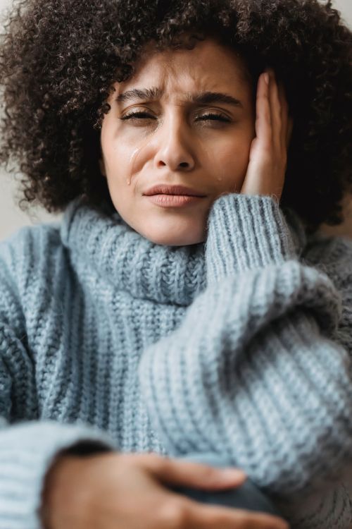 Frowning black woman crying and looking at camera · Free Stock Photo
