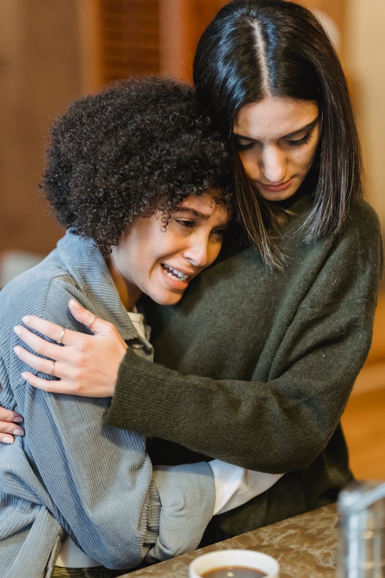 Young Unhappy Woman Crying And Hugging Empathetic Female Friend