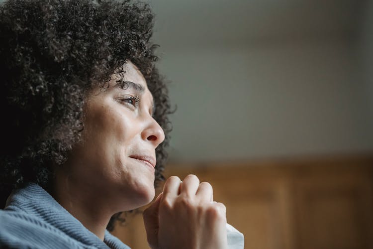 Young Grief Ethnic Lady Crying And Looking Away Pensively