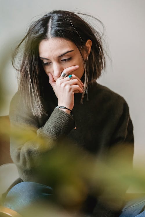 Free Lady crying with hand on mouth in room Stock Photo