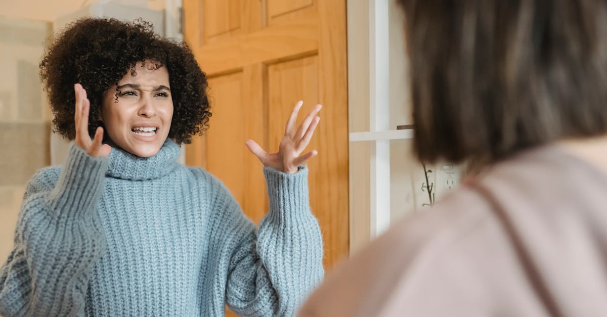 Forgiveness In Friendships, Physical Scene Of Two Friends Having A Serious Conversation With One Looking Upset And The Other Appearing Defensive