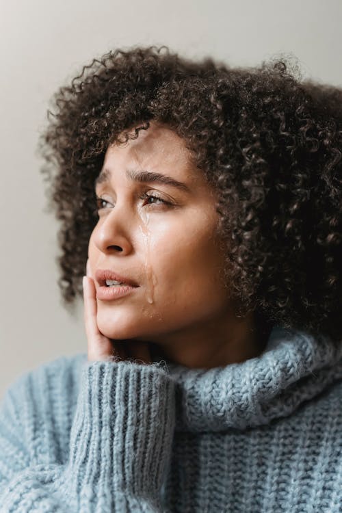 Free Thoughtful ethnic woman with tears on face Stock Photo