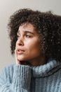 Thoughtful ethnic woman with tears on face