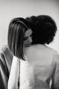Young women hugging after quarrel