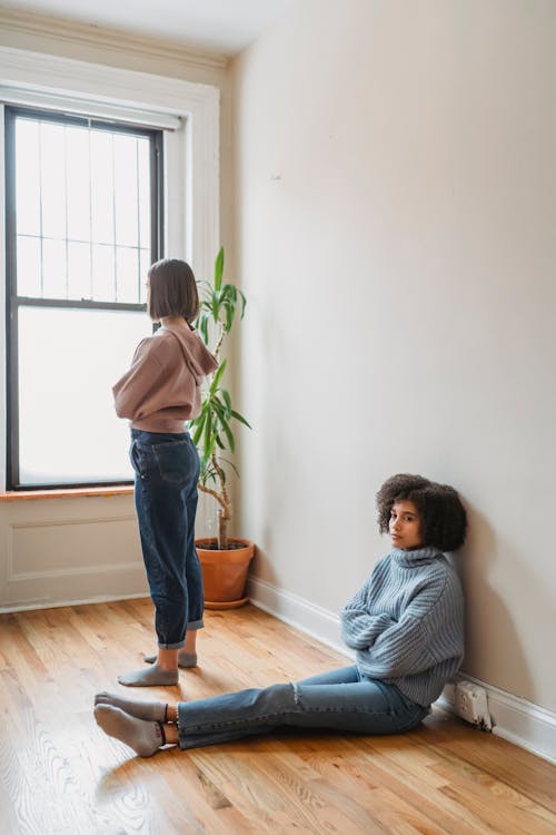 Upset women in room during quarrel